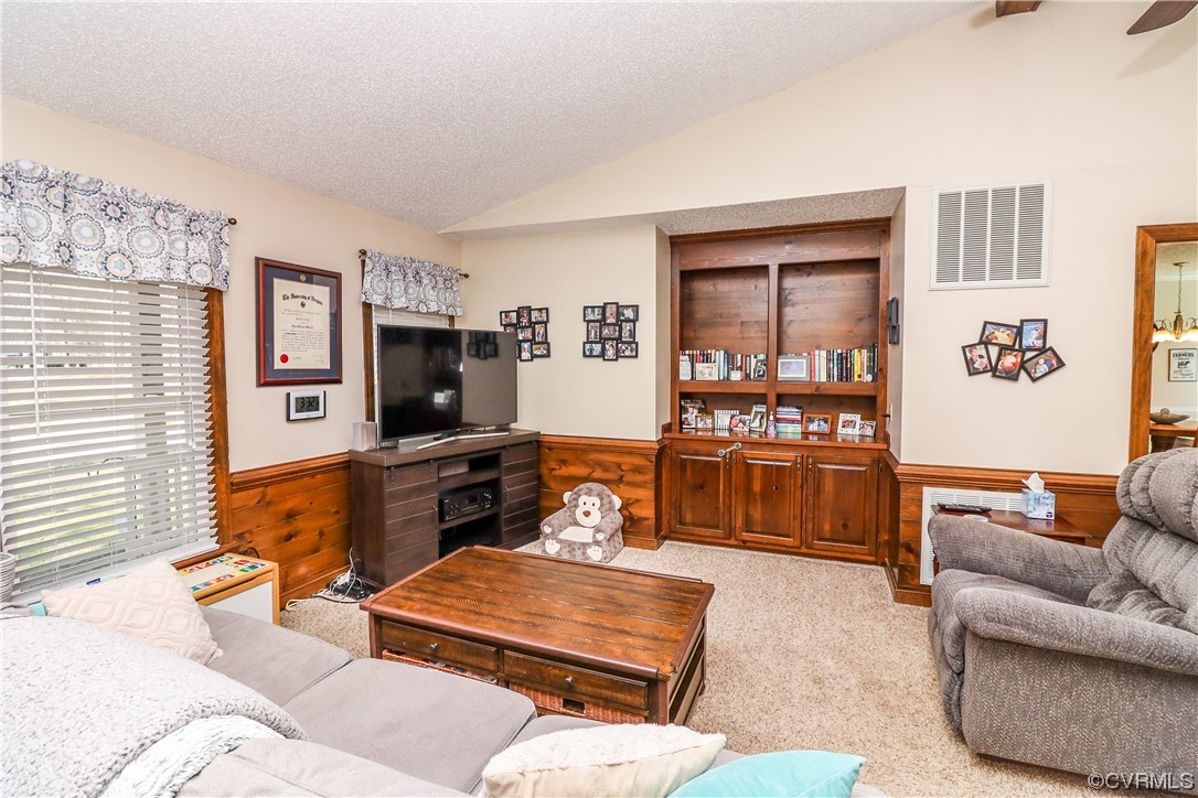 2210 Mill Road Powhatan, VA 23139 - Photo 8 of 36 a living room with furniture and a flat screen tv
