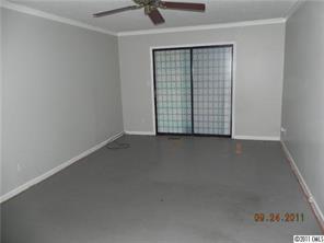 9511 Fairway Ridge Road Charlotte, NC 28277 - Photo 3 of 5 an empty room with a door