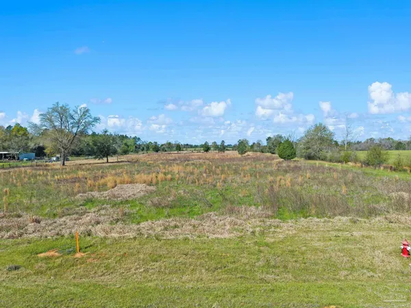 a view of a yard with an ocean