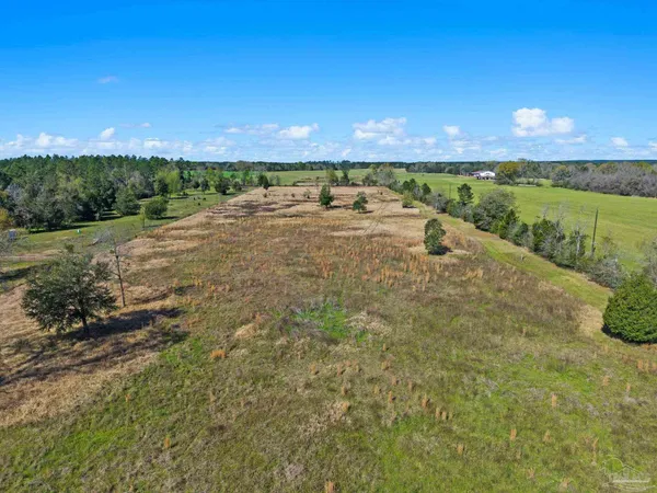 a view of an ocean beach and a yard