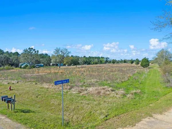 a view of lake with green space