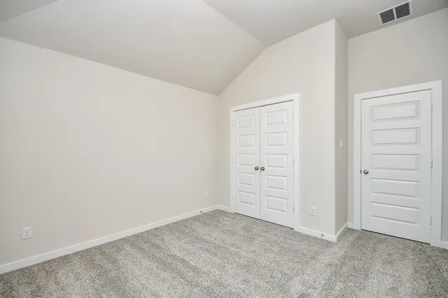 a view of a house with backyard and garden