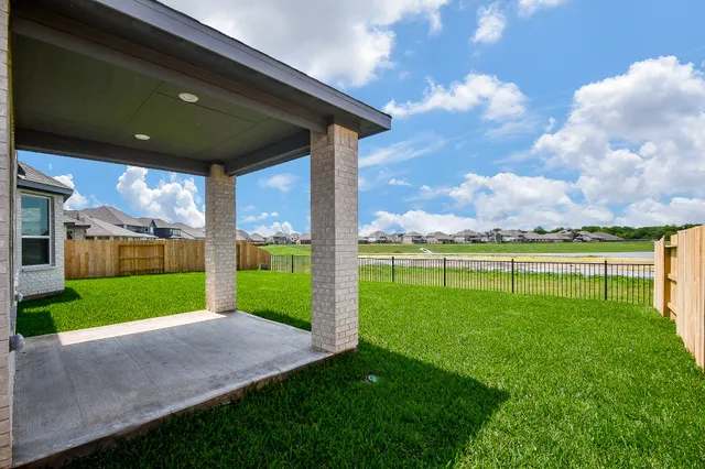 a view of a brick house with a large windows