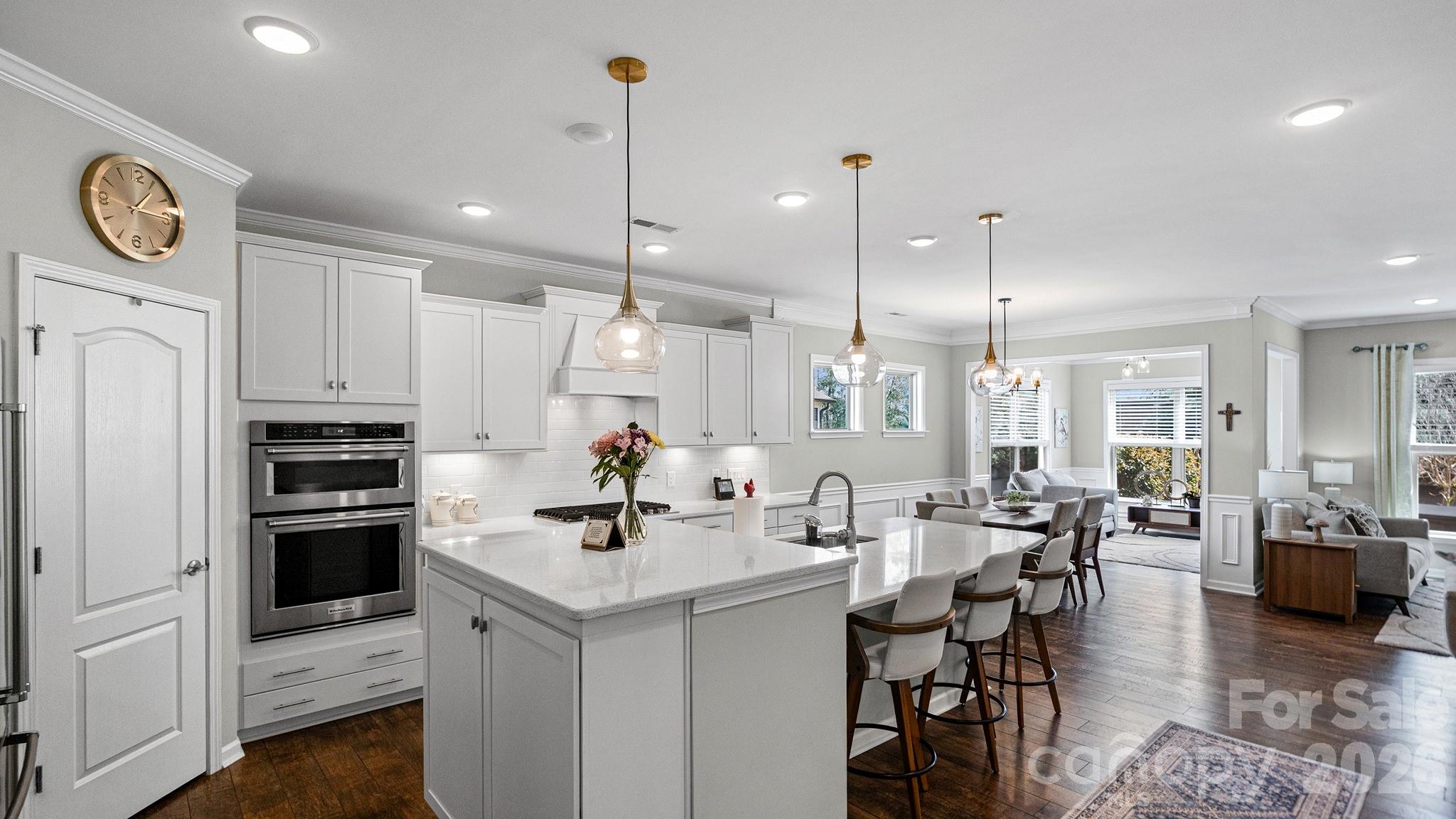 952 Kirby Drive Fort Mill, SC 29715 - Photo 12 of 42 a kitchen with a sink stainless steel appliances and chairs