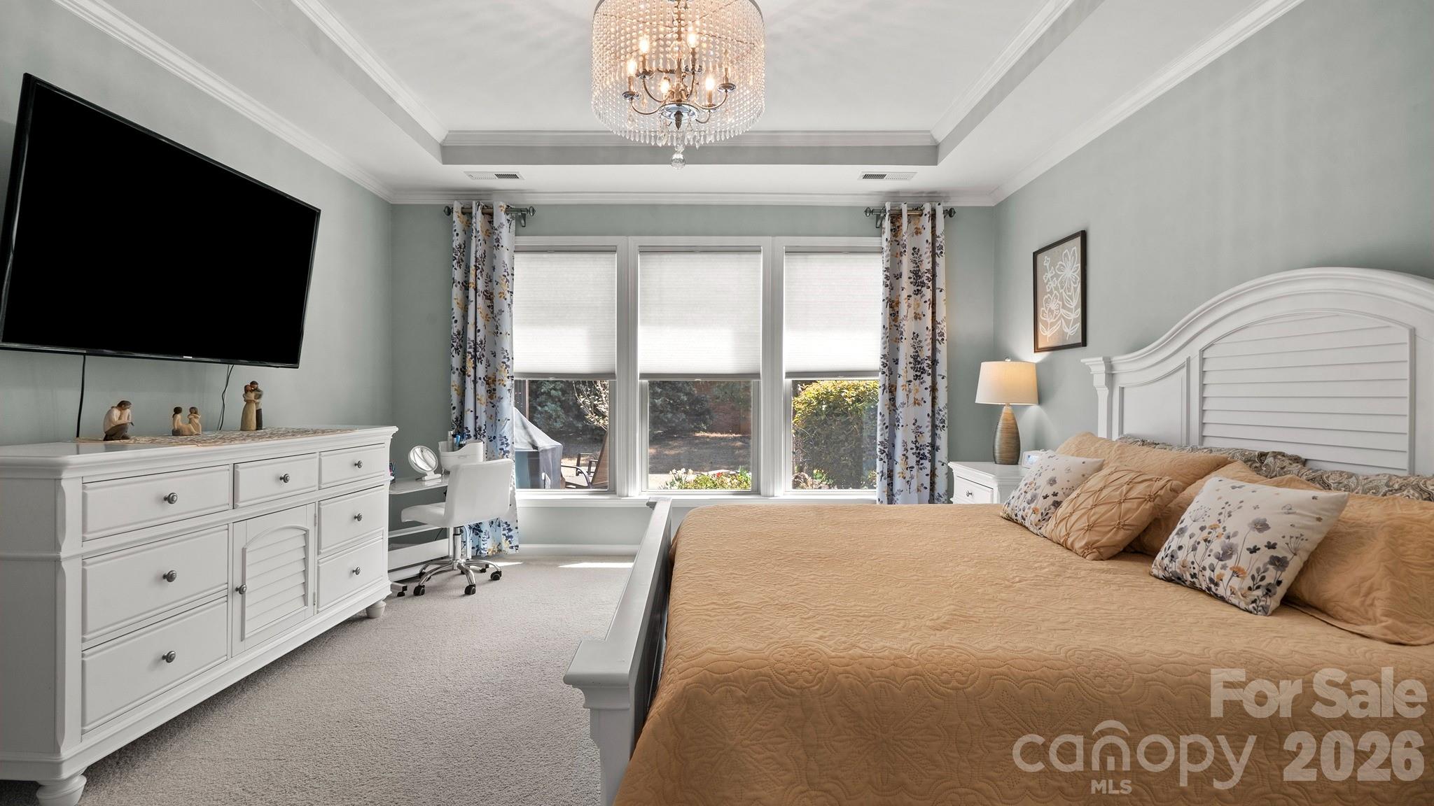 952 Kirby Drive Fort Mill, SC 29715 - Photo 16 of 42 a spacious bedroom with a large bed and a flat screen tv