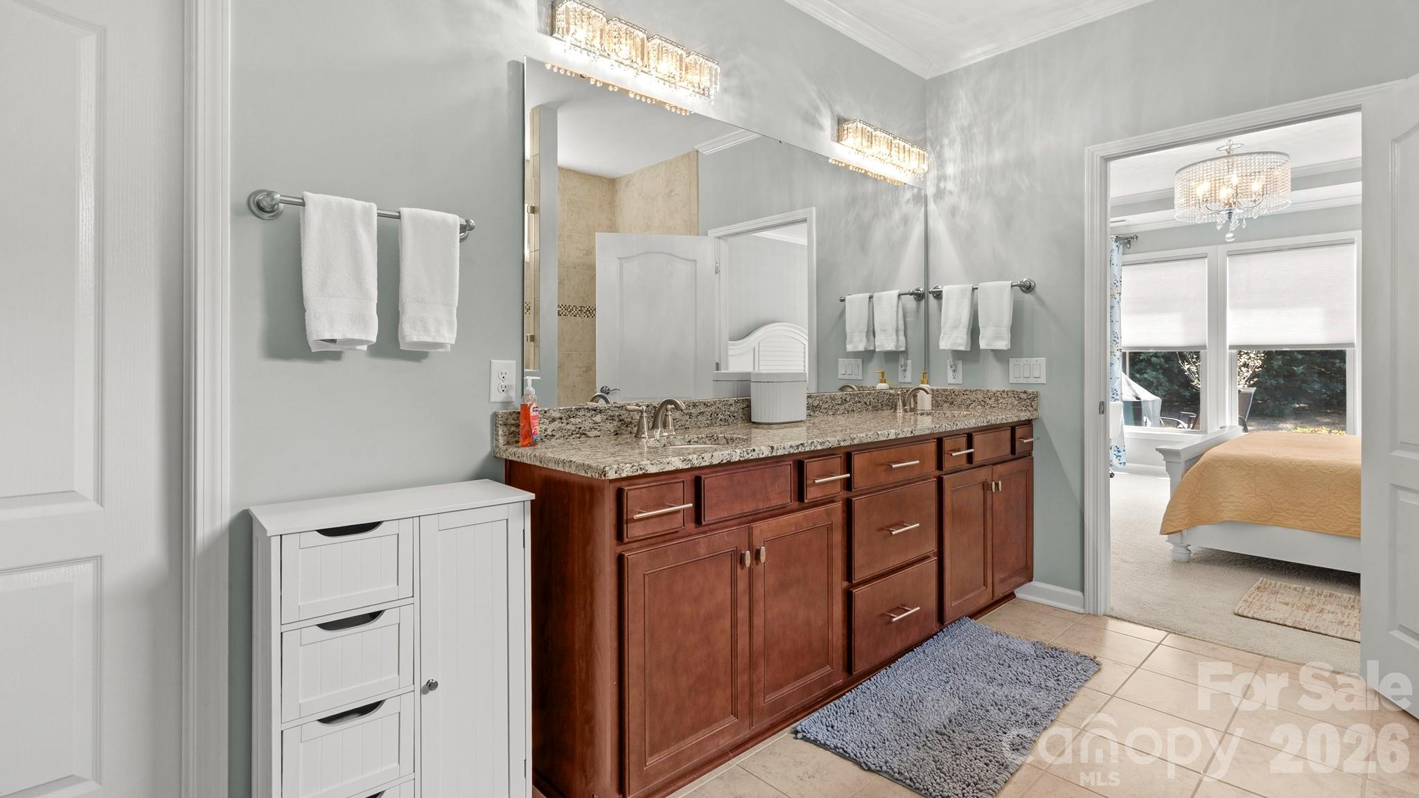 952 Kirby Drive Fort Mill, SC 29715 - Photo 19 of 42 a bathroom with a granite countertop sink and a mirror