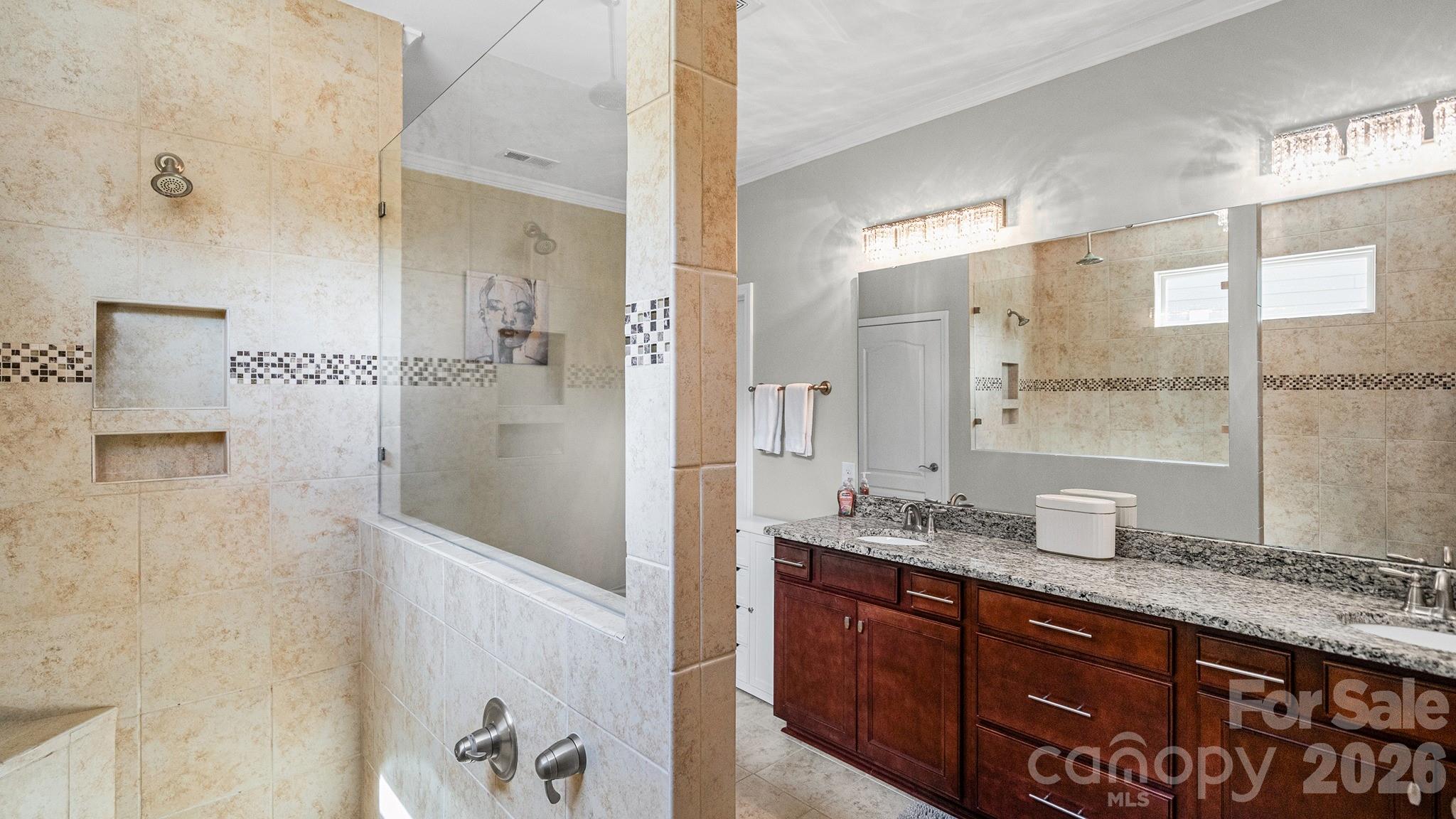 952 Kirby Drive Fort Mill, SC 29715 - Photo 20 of 42 a bathroom with a granite countertop shower sink and mirror