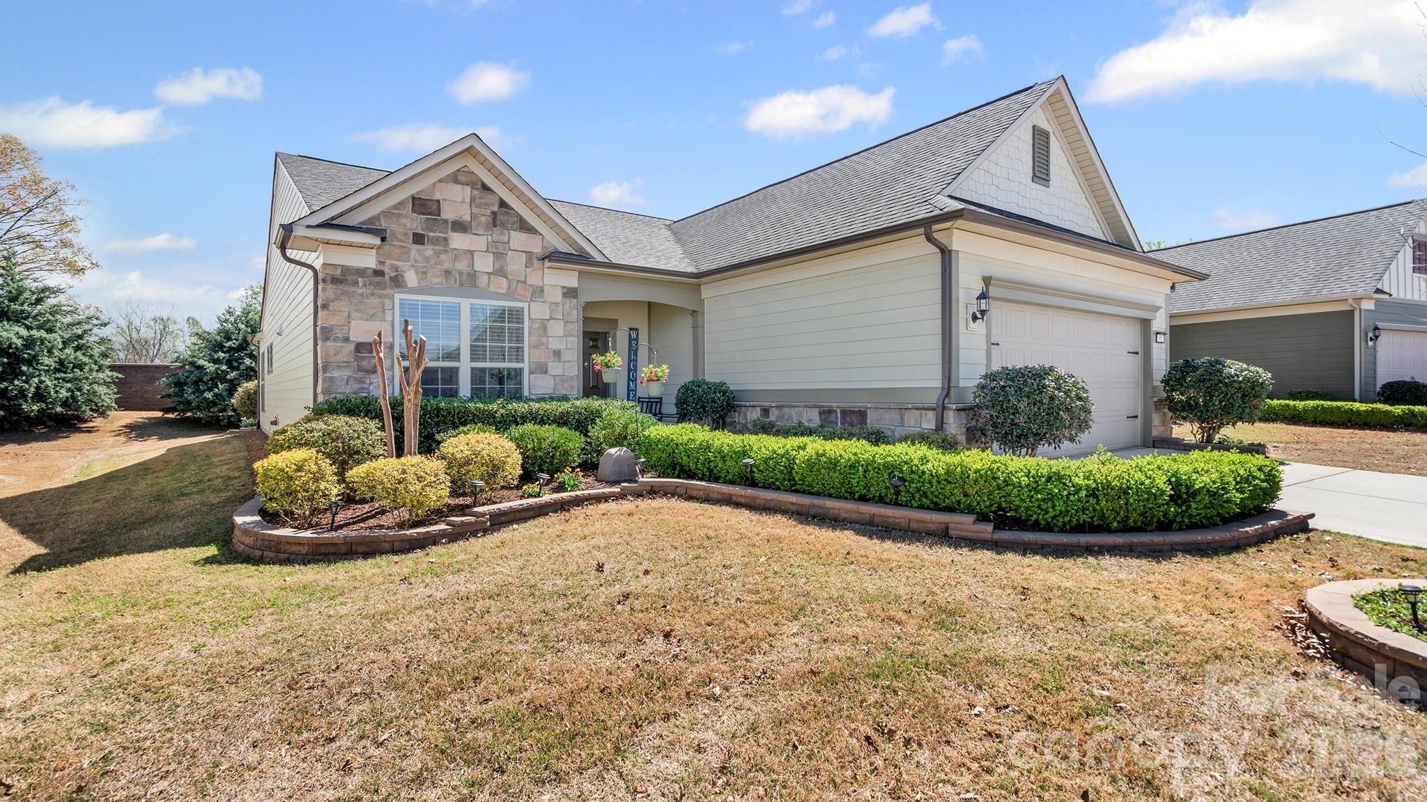 952 Kirby Drive Fort Mill, SC 29715 - Photo 2 of 42 a front view of a house with a yard and outdoor seating