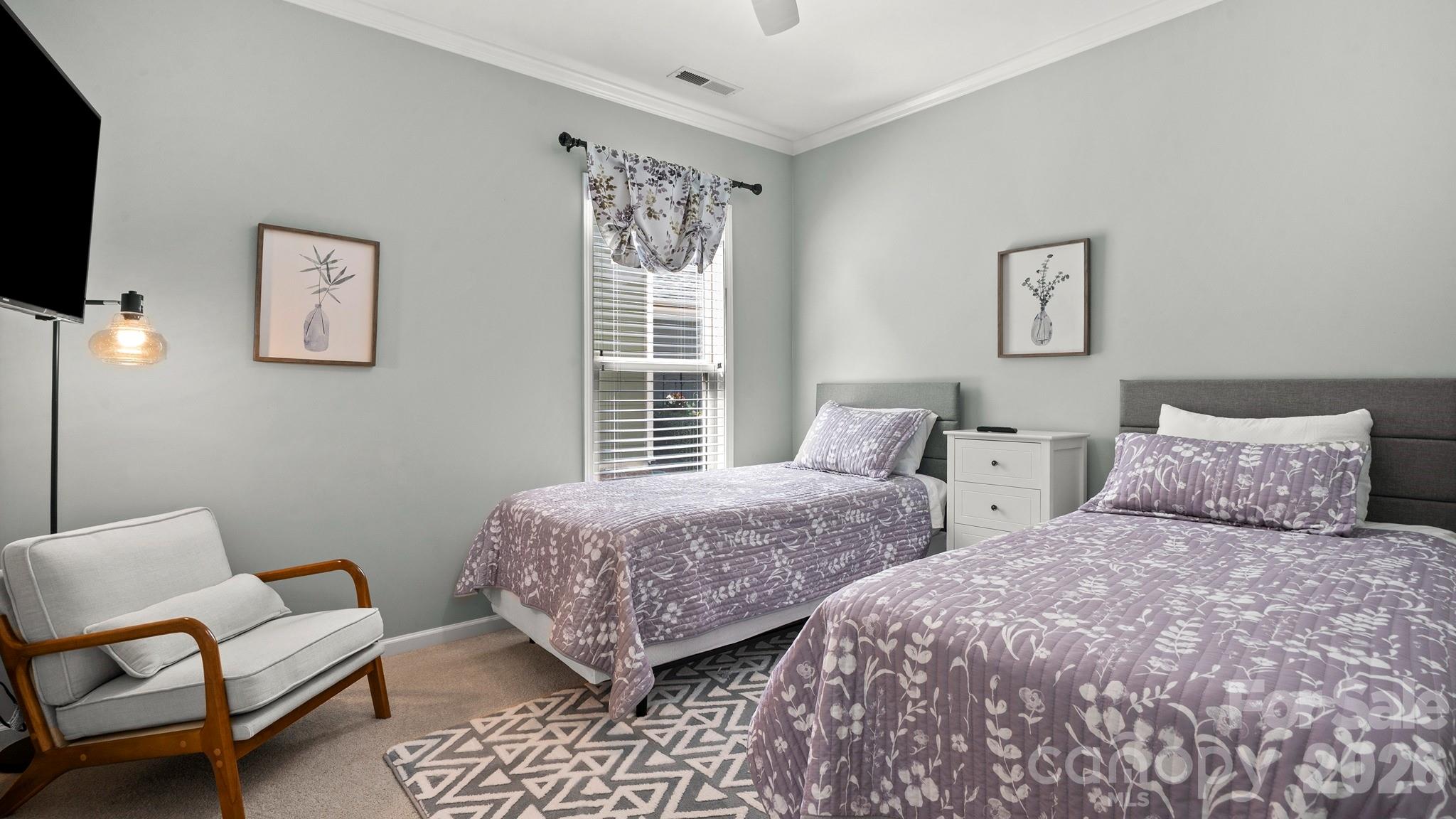 952 Kirby Drive Fort Mill, SC 29715 - Photo 22 of 42 a bedroom with two beds and a couch