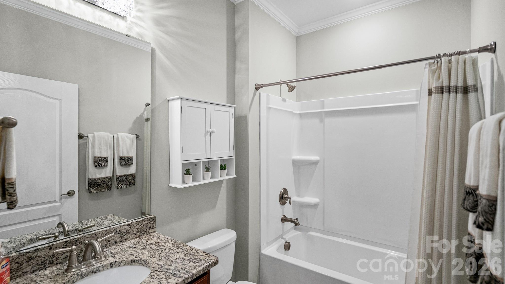 952 Kirby Drive Fort Mill, SC 29715 - Photo 23 of 42 a bathroom with a granite countertop shower a sink and a mirror