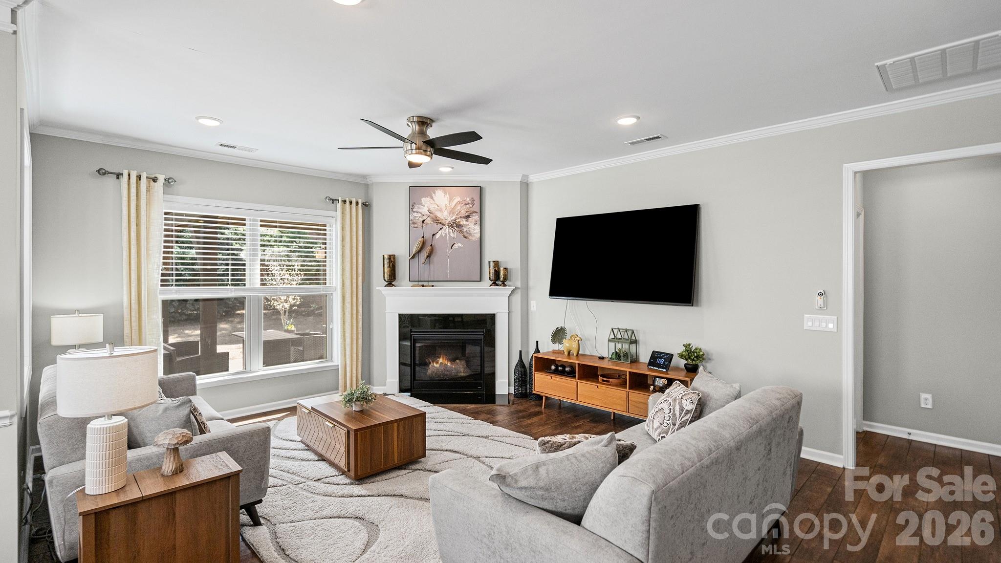 952 Kirby Drive Fort Mill, SC 29715 - Photo 27 of 42 a living room with furniture fireplace and a flat screen tv