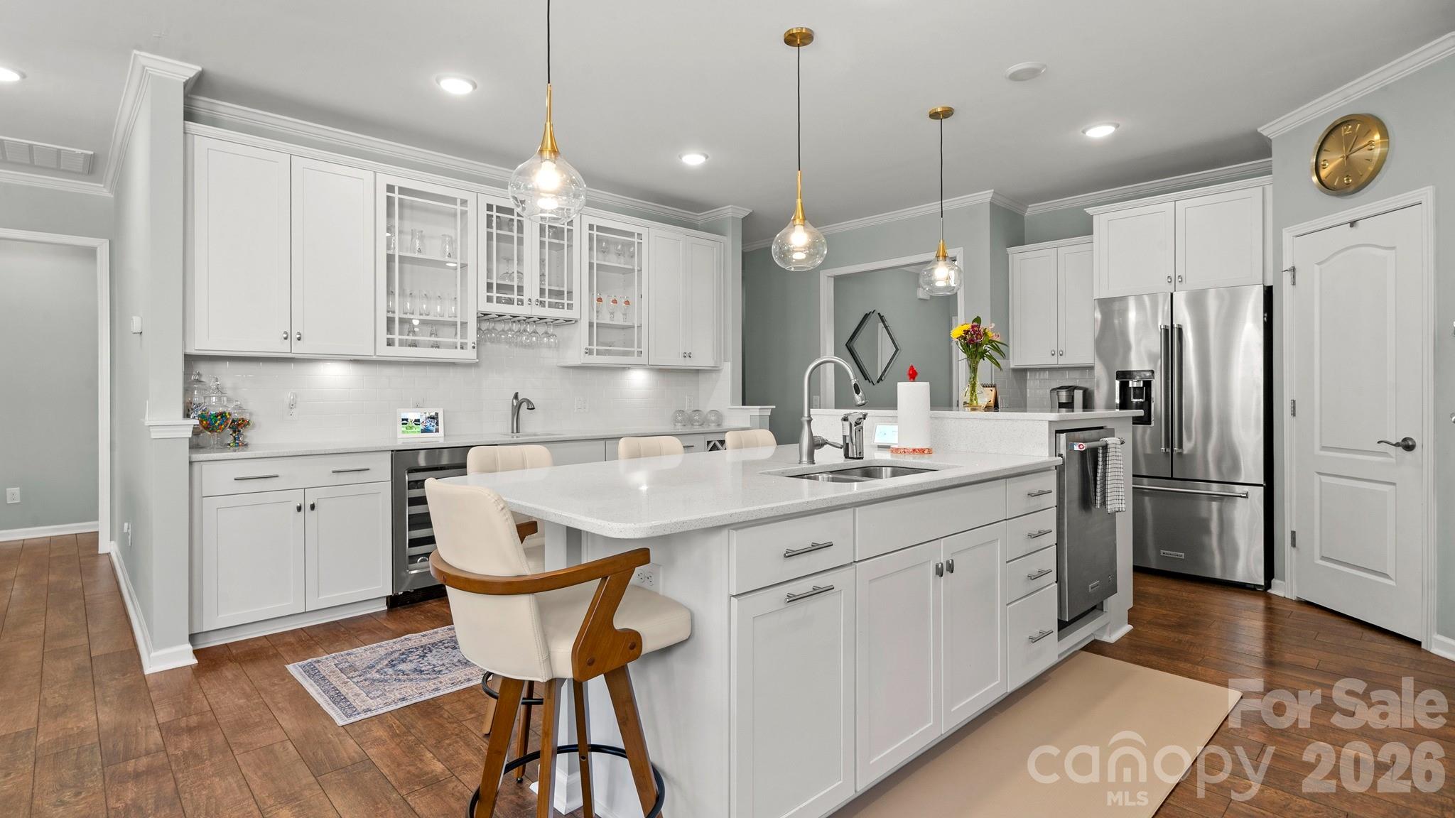 952 Kirby Drive Fort Mill, SC 29715 - Photo 8 of 42 a kitchen with kitchen island granite countertop a sink a center island and stainless steel appliances