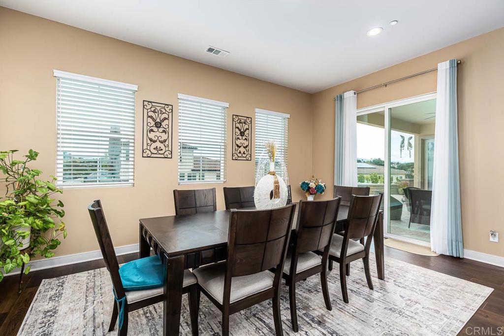 1194 Palomar Circle Escondido, CA 92027 - Photo 11 of 37 a view of a dining room with furniture and wooden floor