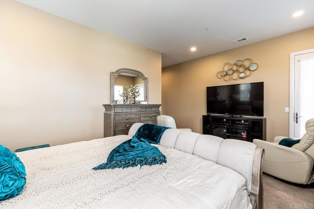 1194 Palomar Circle Escondido, CA 92027 - Photo 12 of 37 a living room with furniture and a flat screen tv