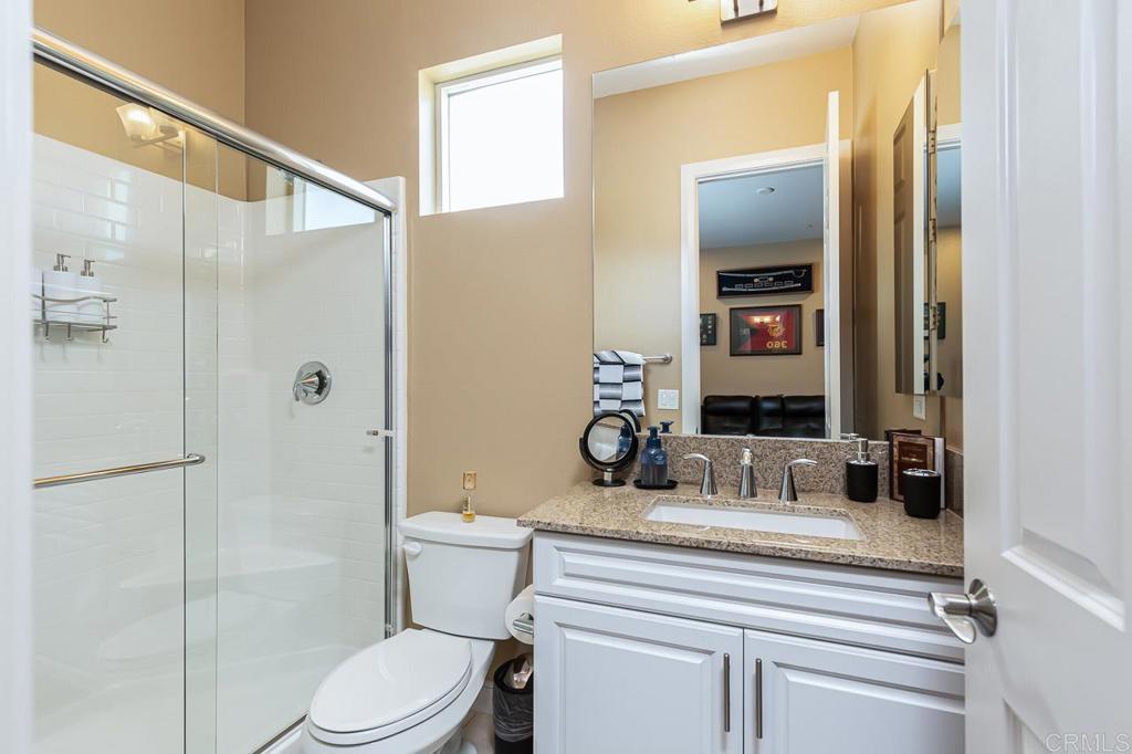 1194 Palomar Circle Escondido, CA 92027 - Photo 19 of 37 a bathroom with a sink toilet and shower