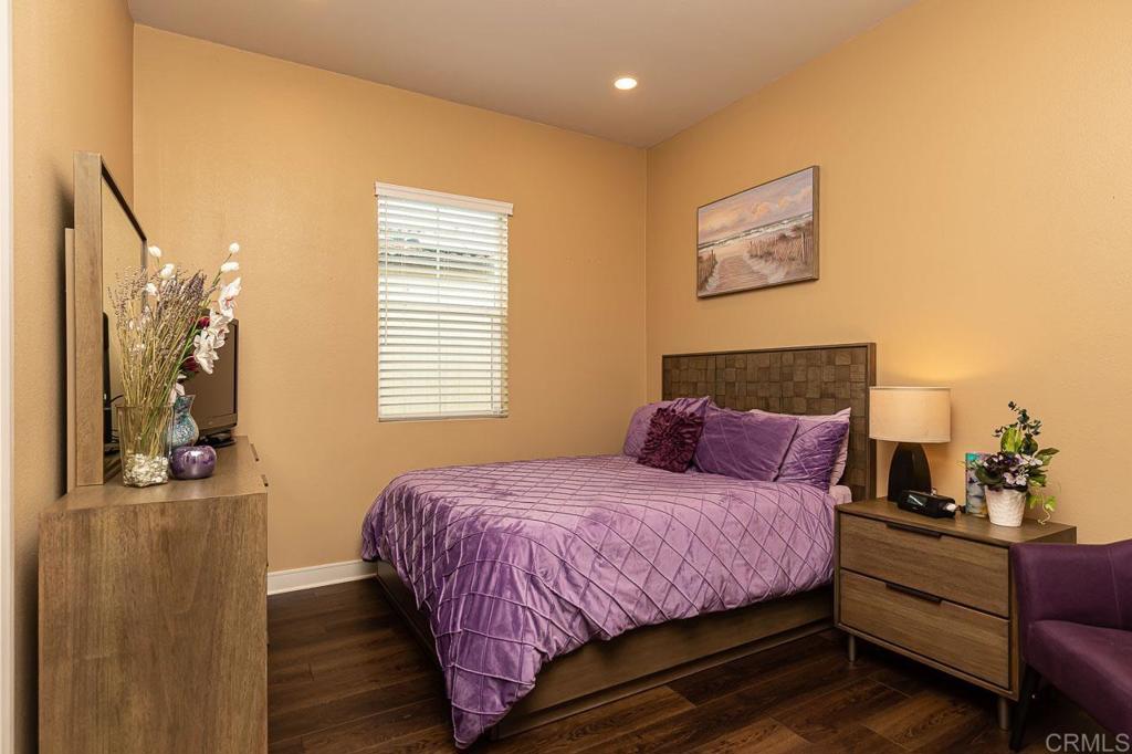 1194 Palomar Circle Escondido, CA 92027 - Photo 20 of 37 a bedroom with a bed and wooden floor