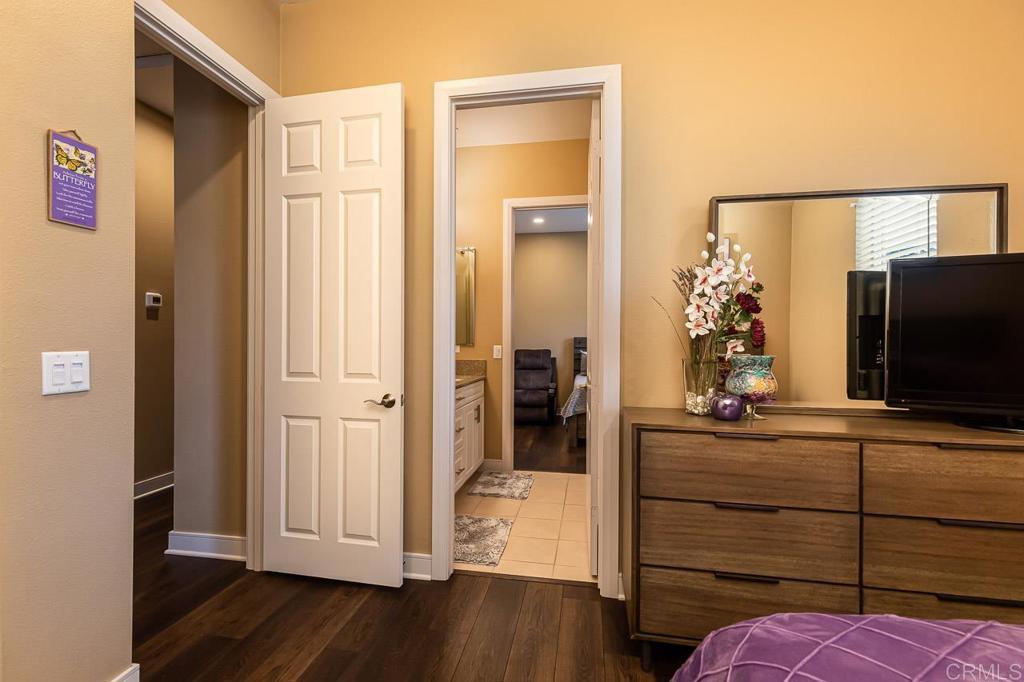 1194 Palomar Circle Escondido, CA 92027 - Photo 21 of 37 a view of a hallway and closet with wooden floor