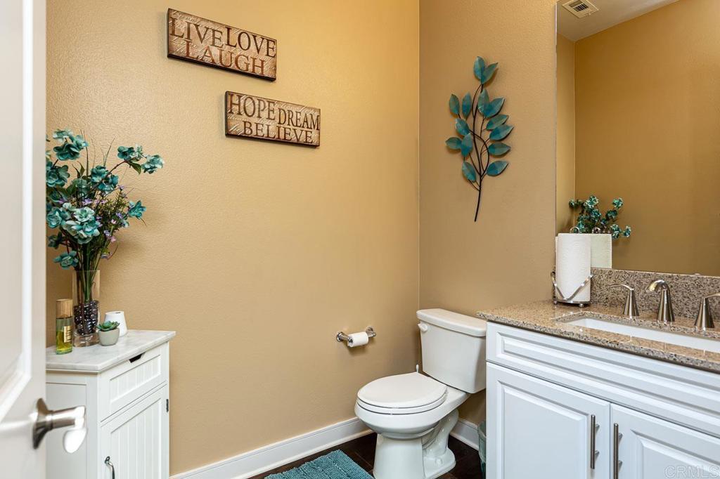 1194 Palomar Circle Escondido, CA 92027 - Photo 25 of 37 a bathroom with a toilet and a sink