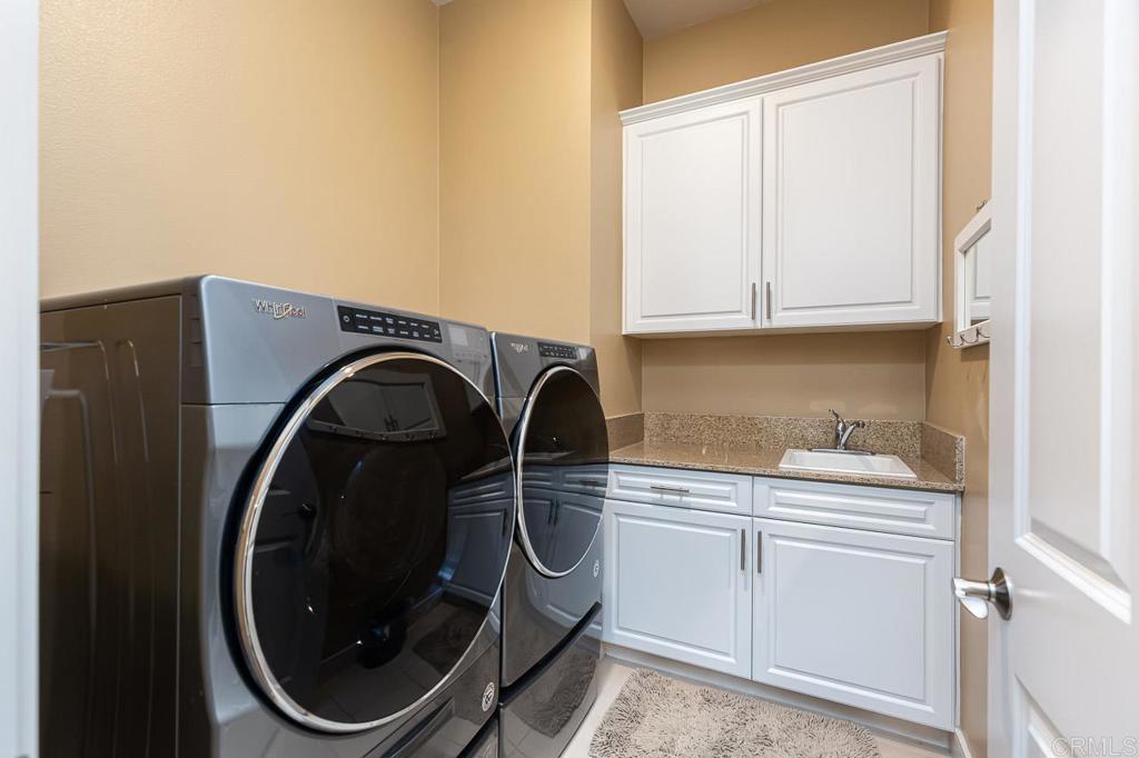 1194 Palomar Circle Escondido, CA 92027 - Photo 37 of 37 a utility room with sink dryer and washer