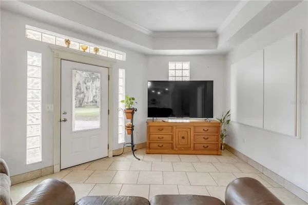 a living room with furniture and flat screen tv