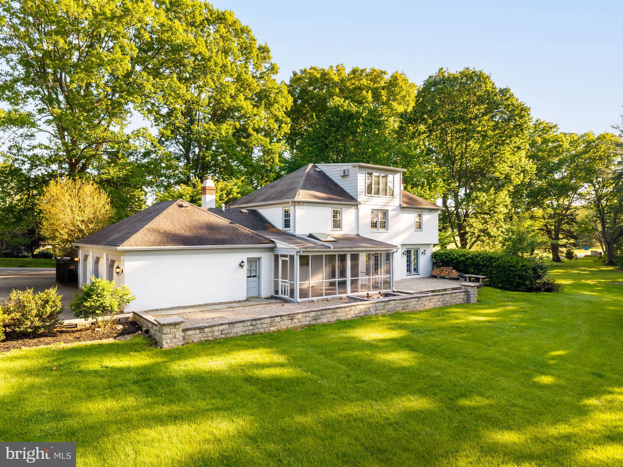 533 Gulph Road Wayne, PA 19087 - Photo 3 of 43 a front view of a house with swimming pool and green space