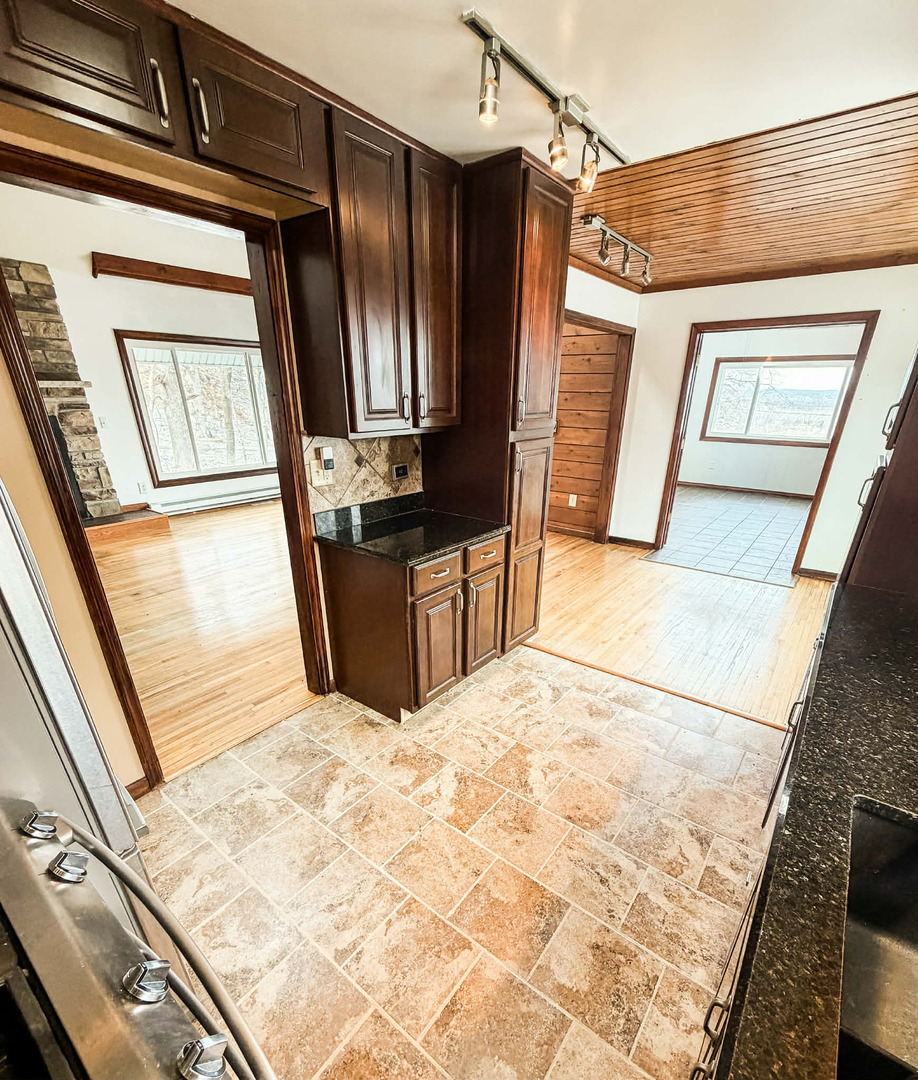 2211 613th Avenue Sabula, IA 52070 - Photo 13 of 45 a view of a kitchen with wooden floor and a sink