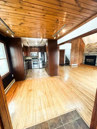 a view of a hall with wooden floor