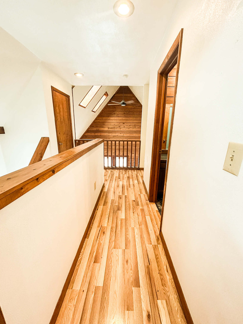 2211 613th Avenue Sabula, IA 52070 - Photo 25 of 45 a view of a hallway with wooden floor