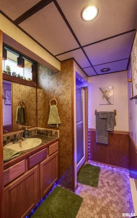 a kitchen with stainless steel appliances granite countertop a sink stove and wooden cabinets