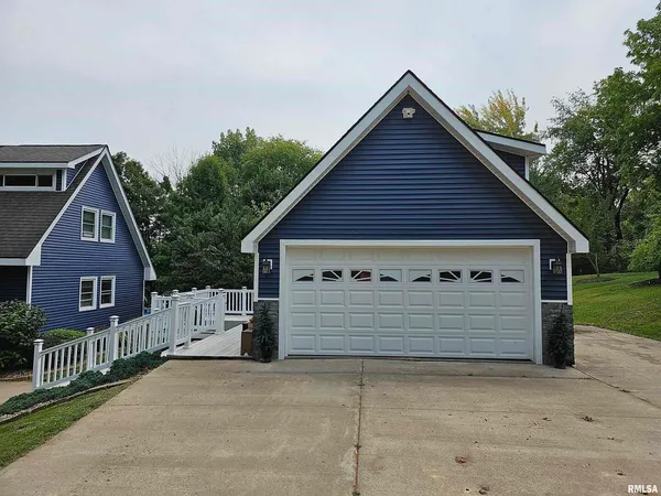 a front view of a house with a garage