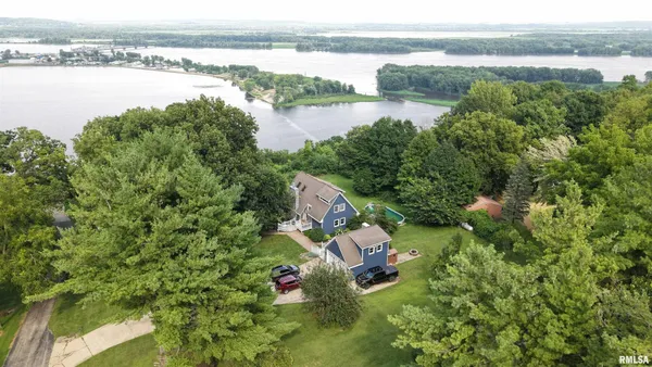 a aerial view of a house with a lake view