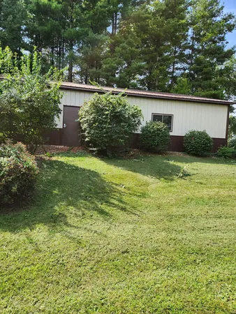 a view of a back yard of the house