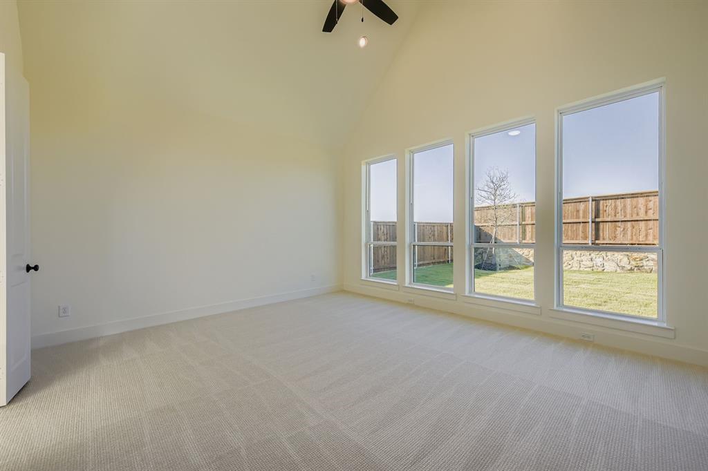 1906 M3 Ranch Road Mansfield, TX 76063 - Photo 15 of 29 Empty room with high vaulted ceiling, light colored carpet, a ceiling fan, and recessed lighting