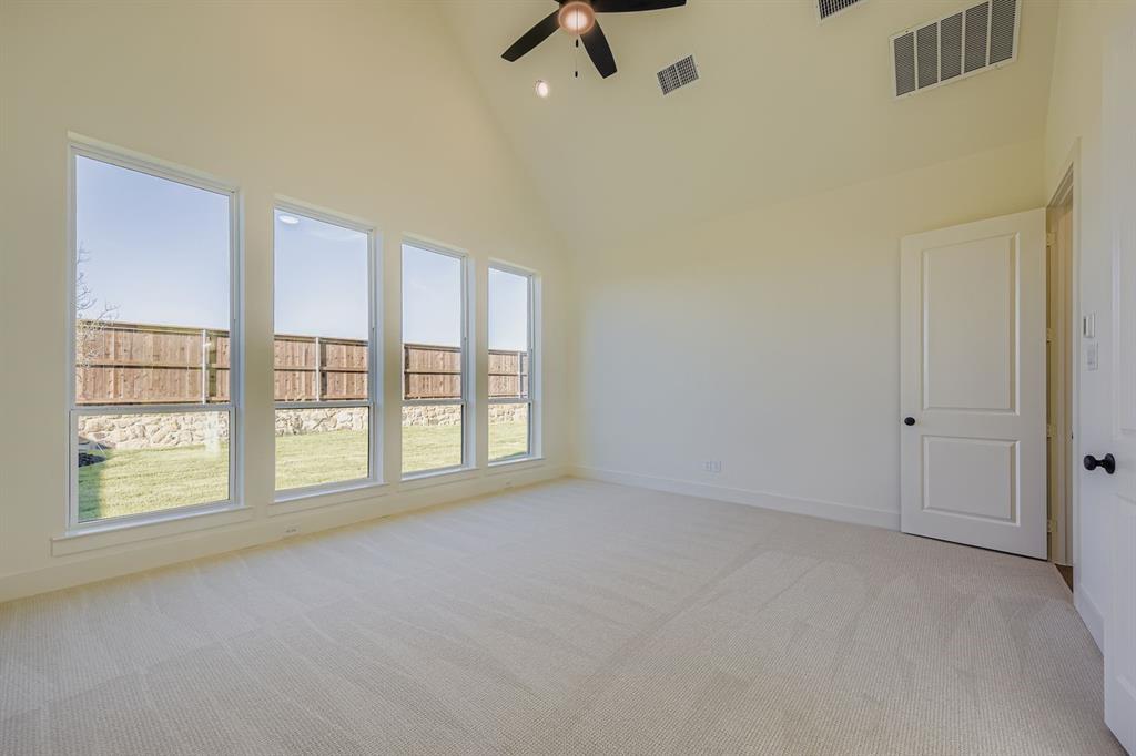 1906 M3 Ranch Road Mansfield, TX 76063 - Photo 16 of 29 Spare room with high vaulted ceiling, light carpet, and ceiling fan