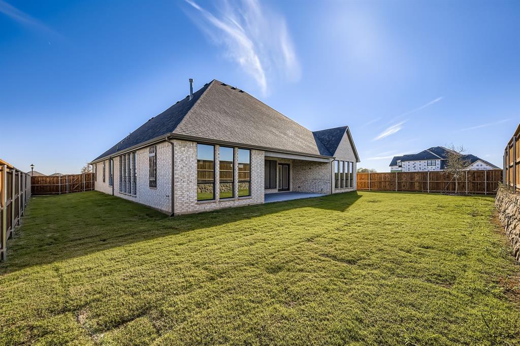 1906 M3 Ranch Road Mansfield, TX 76063 - Photo 27 of 29 Rear view of house with roof with shingles, a patio area, brick siding, and a fenced backyard