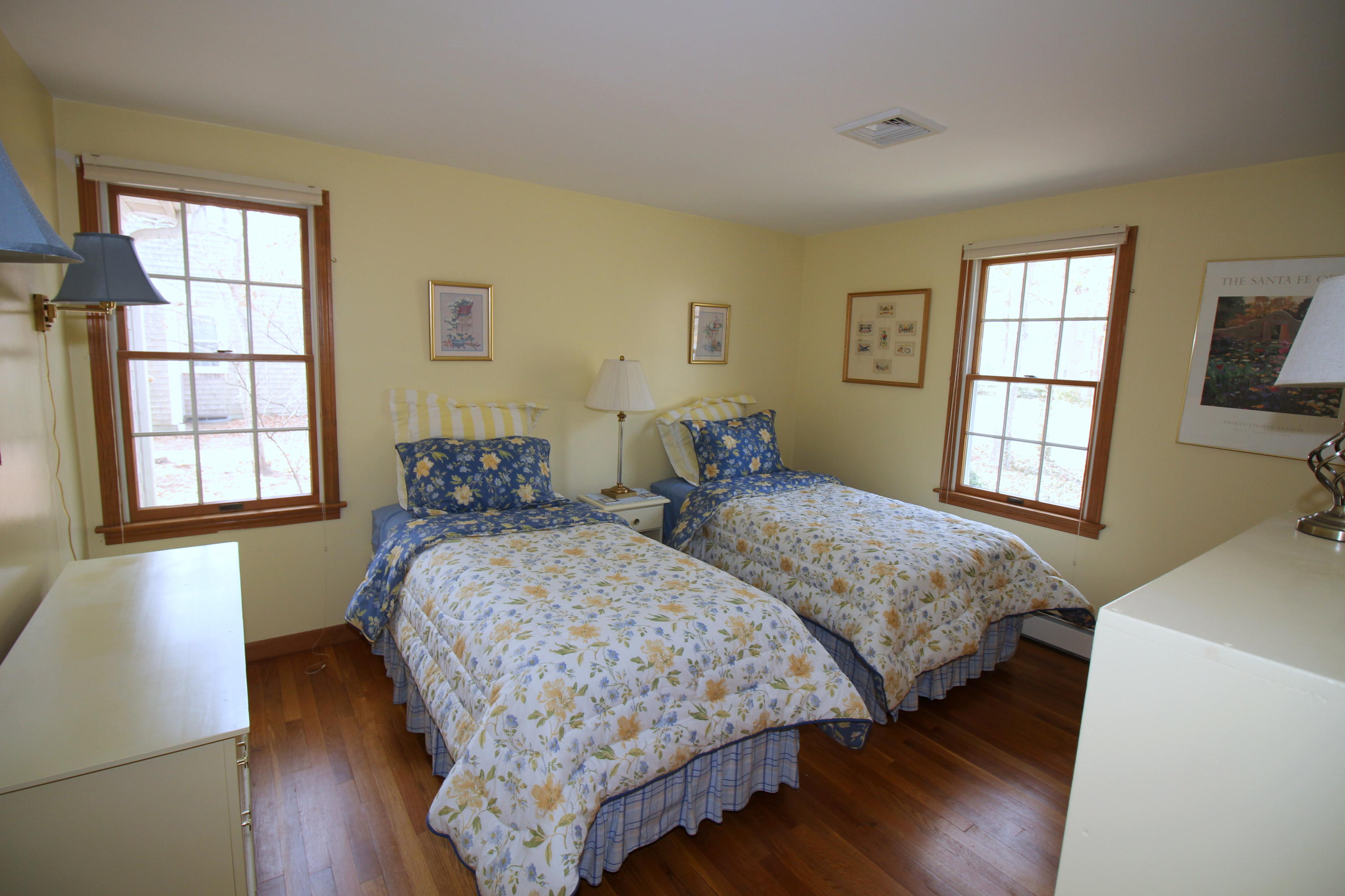 9 Gates Path Dennis, MA 02638 - Photo 11 of 20 a bedroom with two beds and a dresser next to a window