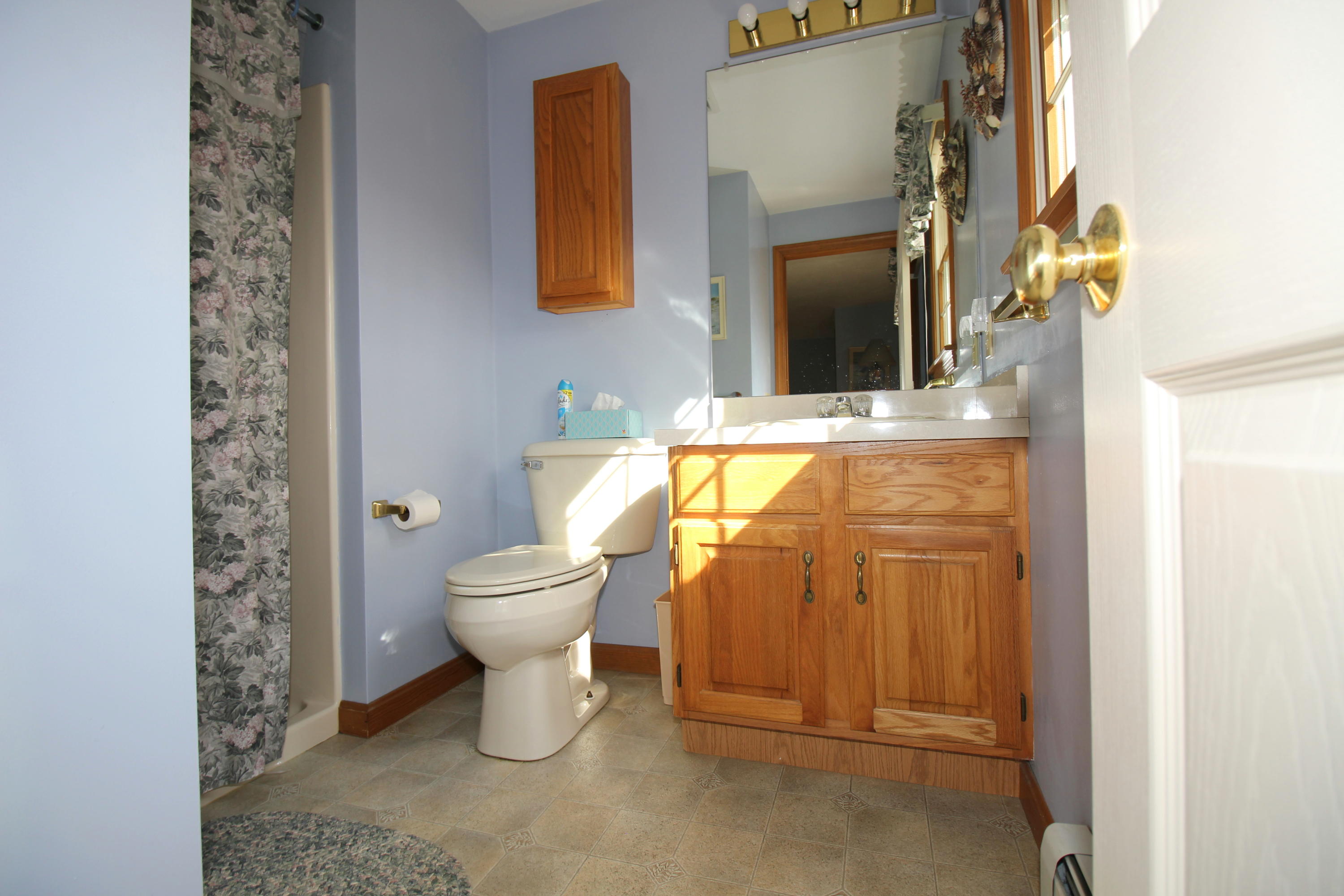 9 Gates Path Dennis, MA 02638 - Photo 17 of 20 a bathroom with a toilet sink and mirror