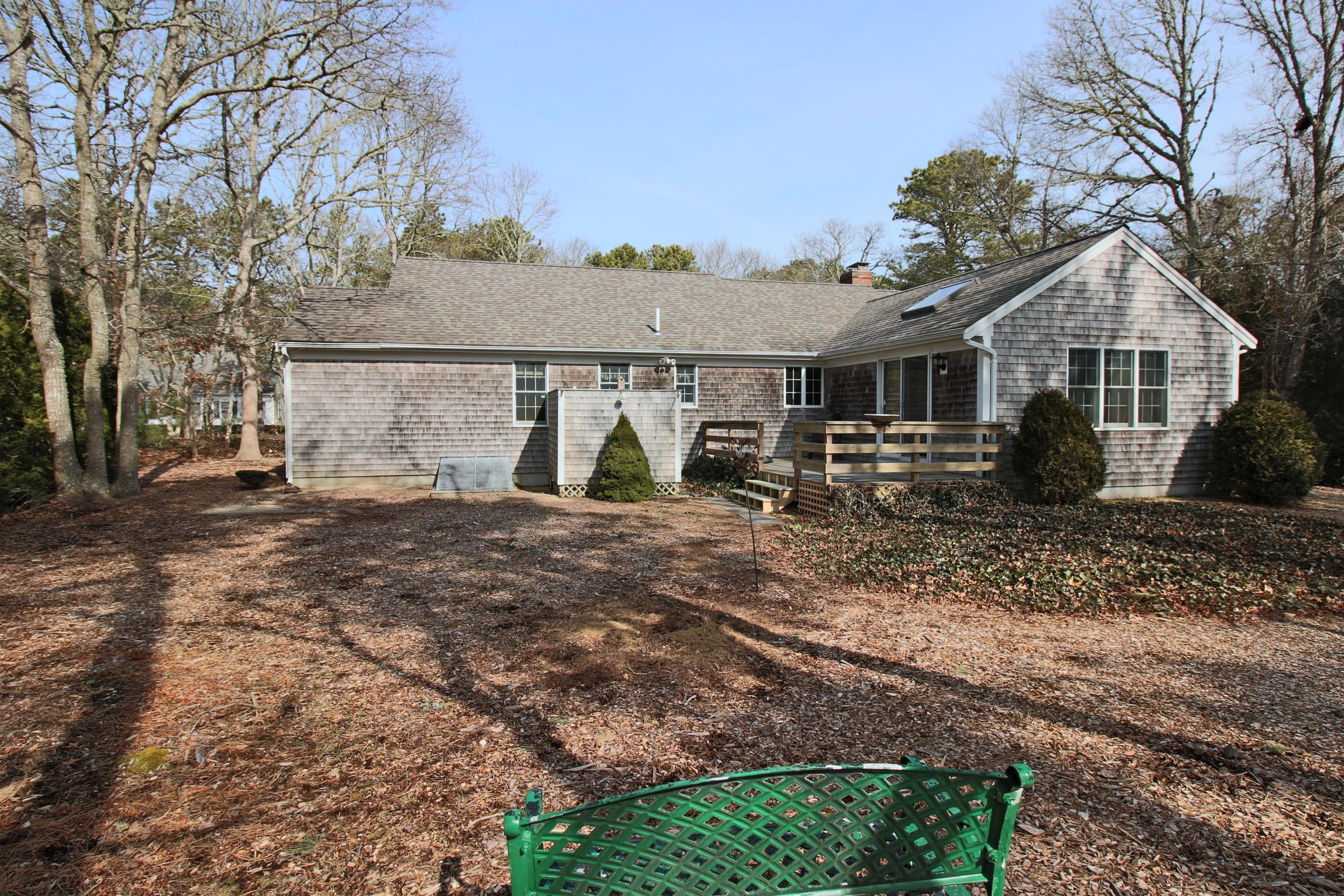 9 Gates Path Dennis, MA 02638 - Photo 18 of 20 a view of a house with backyard