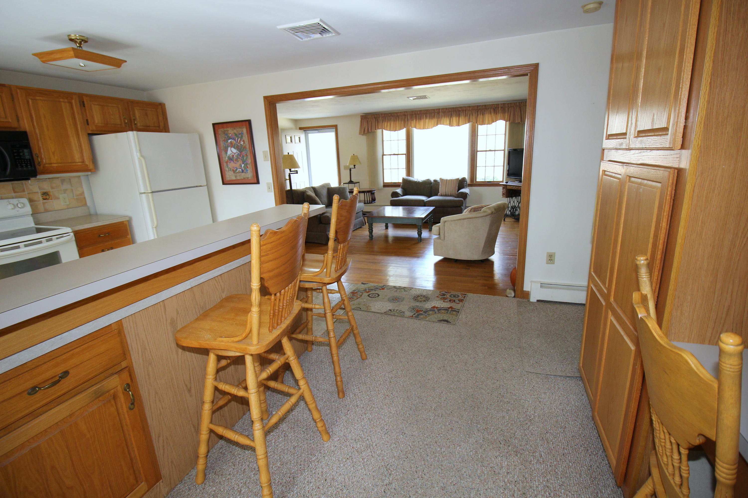 9 Gates Path Dennis, MA 02638 - Photo 5 of 20 a dining room with furniture and a chandelier