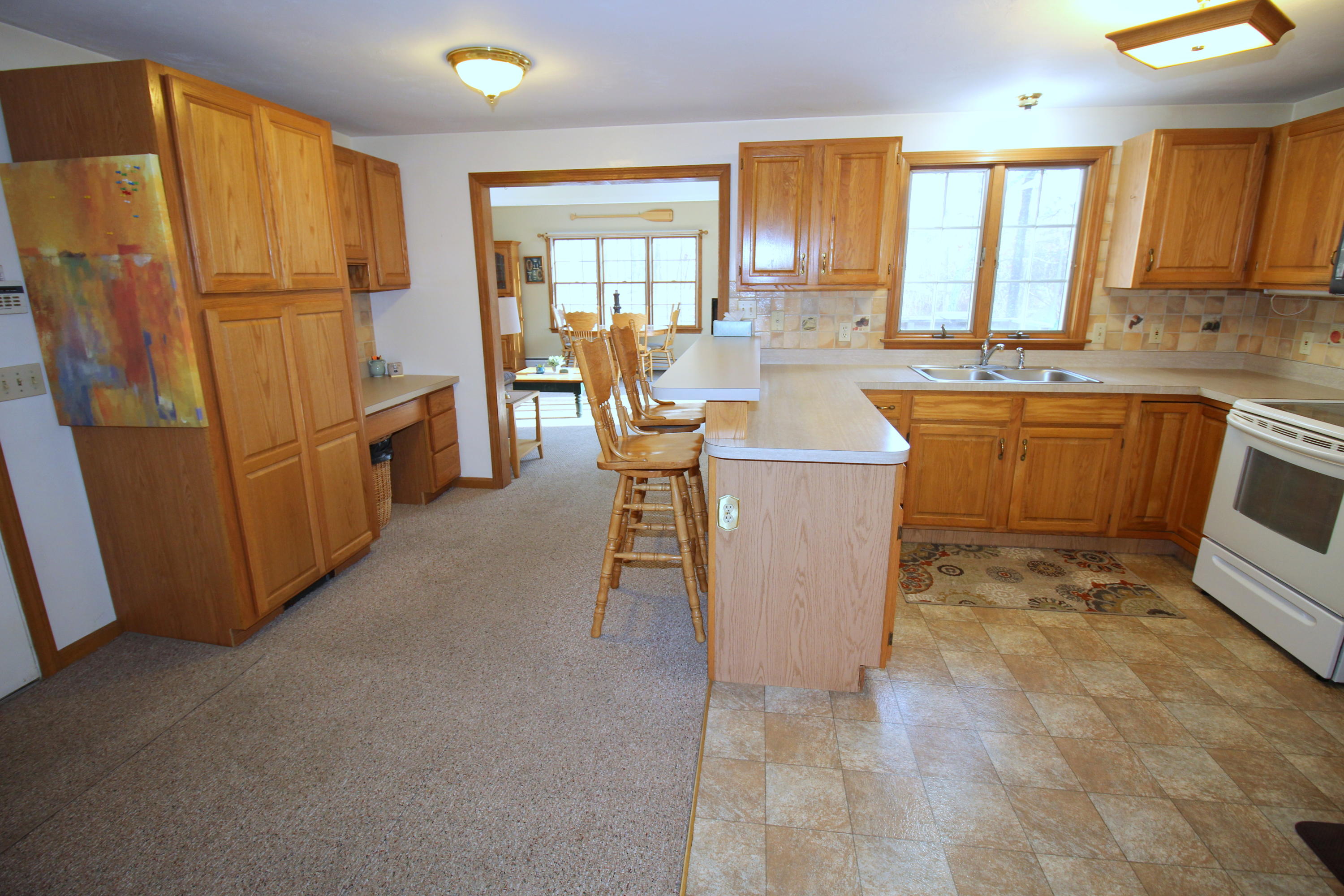 9 Gates Path Dennis, MA 02638 - Photo 6 of 20 a kitchen with refrigerator and sink