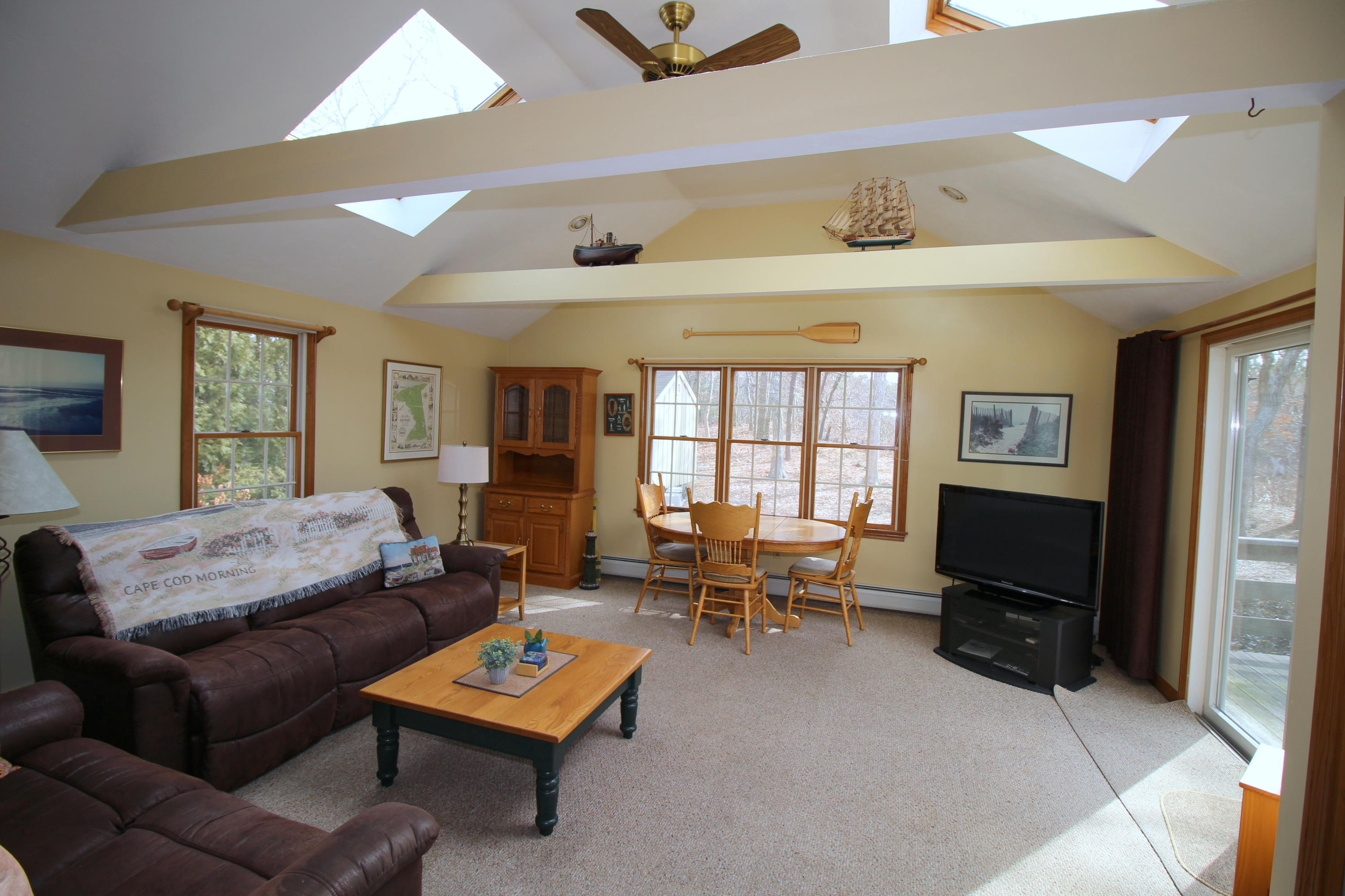 9 Gates Path Dennis, MA 02638 - Photo 8 of 20 a living room with furniture and a flat screen tv