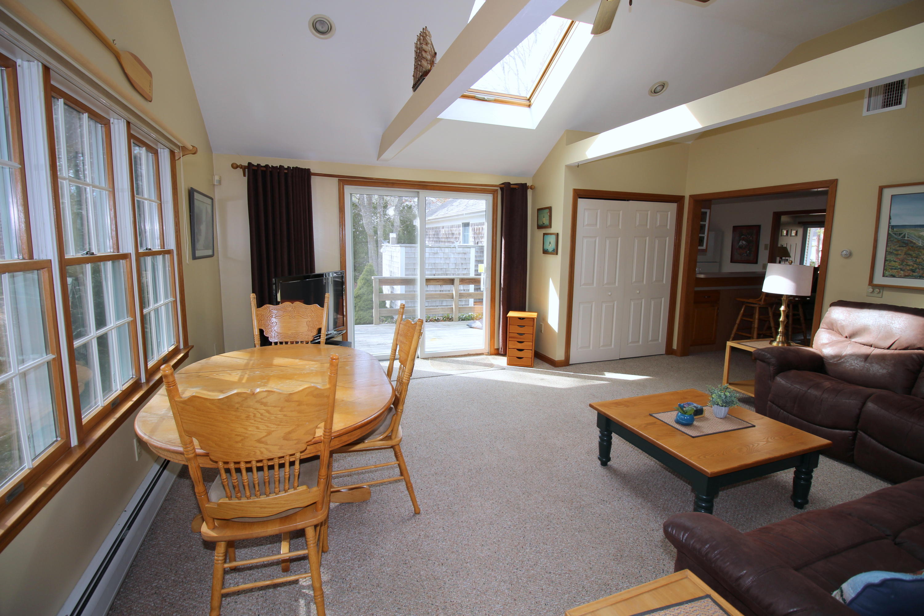 9 Gates Path Dennis, MA 02638 - Photo 9 of 20 a living room with furniture a table and a large window