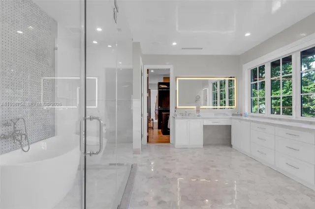 a bathroom with a shower and a bathtub
