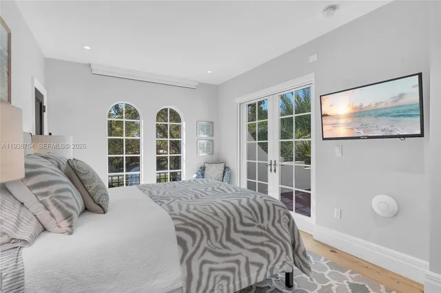a bathroom with a sink mirror vanity and toilet