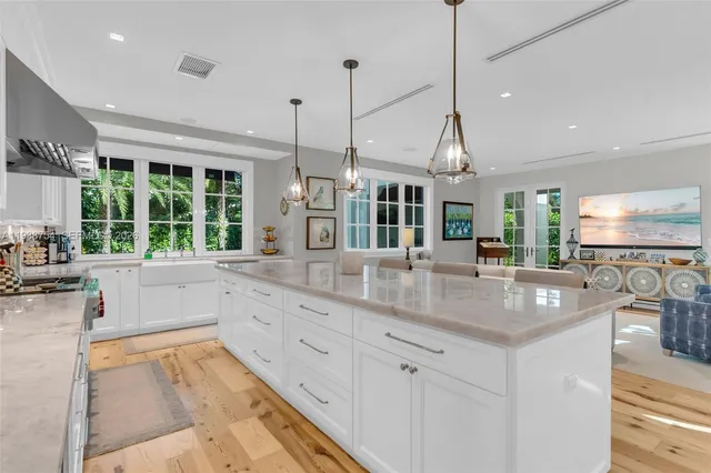 a kitchen with counter top space sink and outdoor space