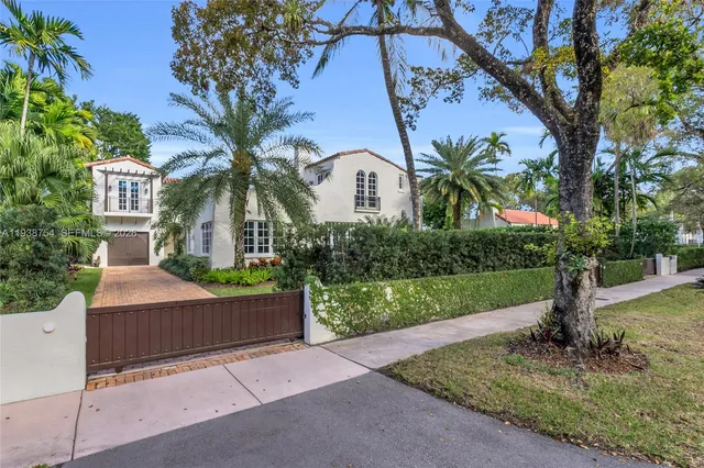 an aerial view of house with yard