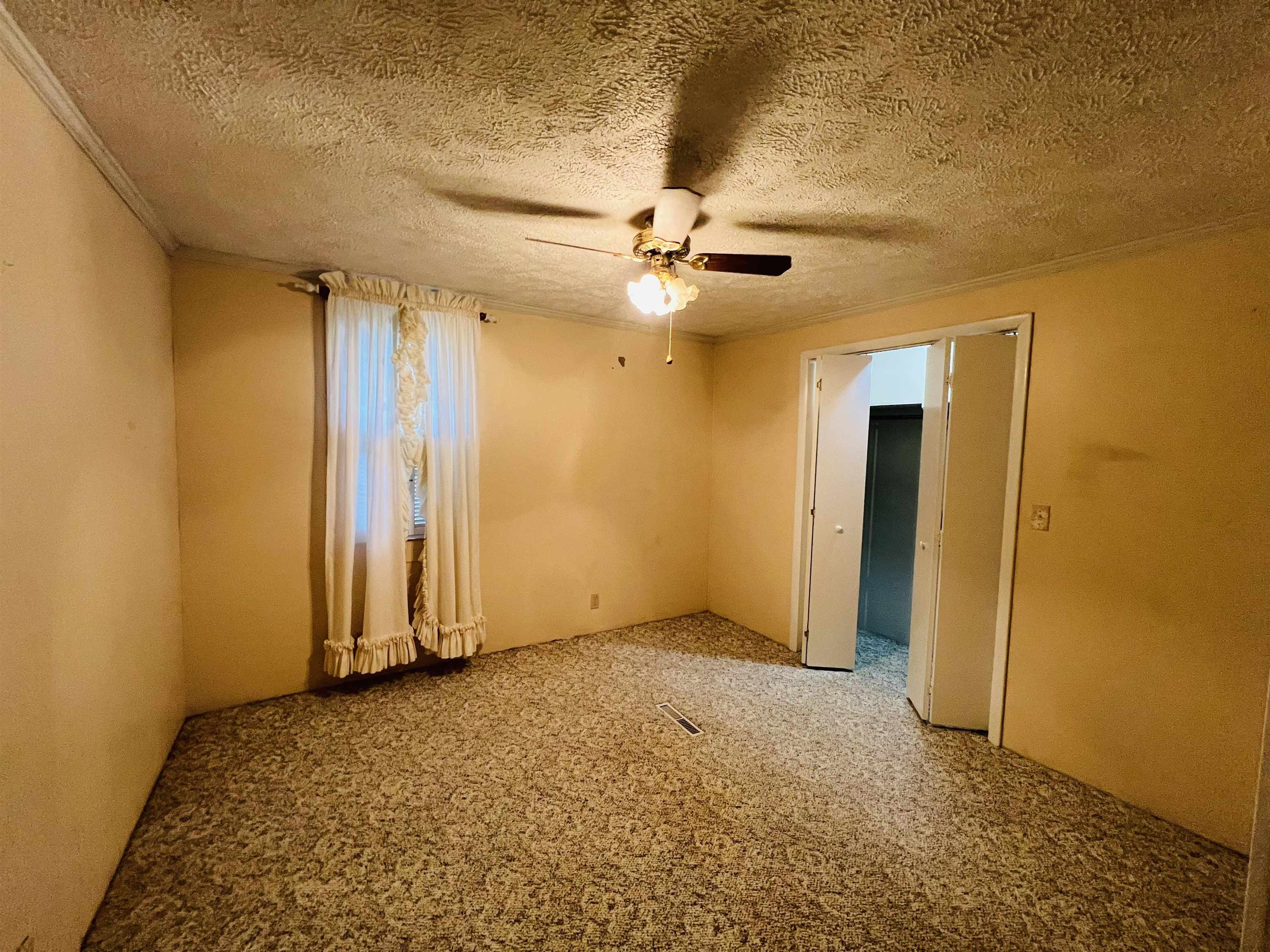 191 West Davis Street Equality, IL 62934 - Photo 19 of 21 wooden floor in an empty room