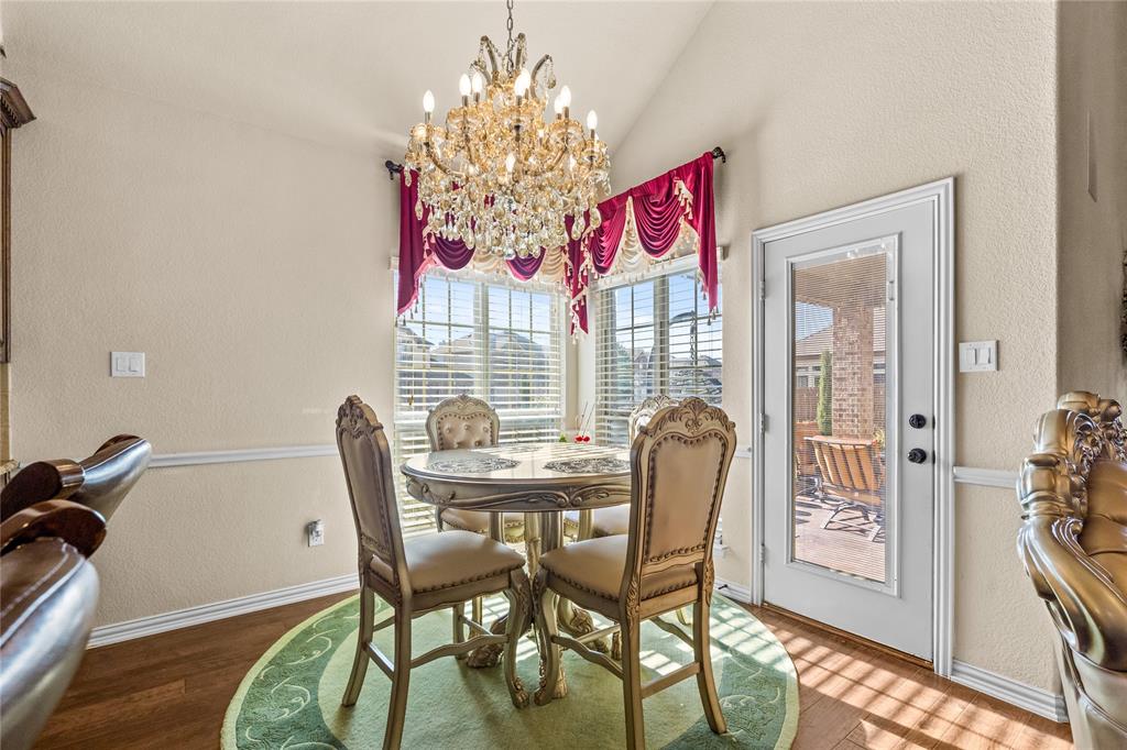 9801 Nolina Road Fort Worth, TX 76177 - Photo 11 of 40 a view of a dining room with furniture and chandelier