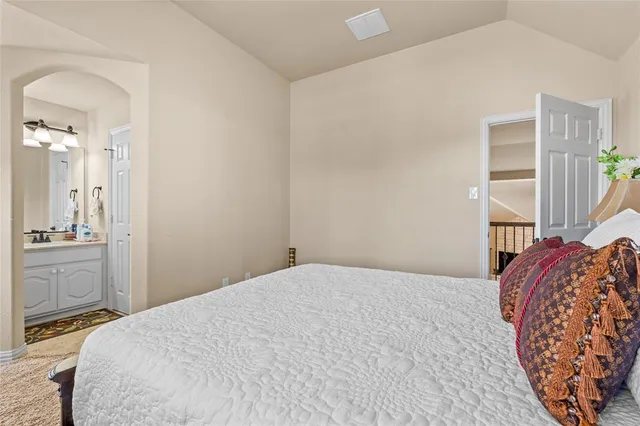 a bedroom with a bed and a dresser