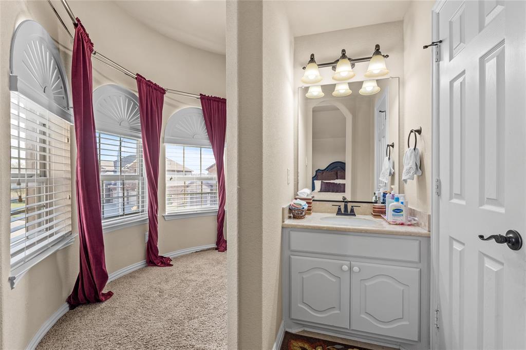 9801 Nolina Road Fort Worth, TX 76177 - Photo 27 of 40 a bathroom with a sink vanity and mirror